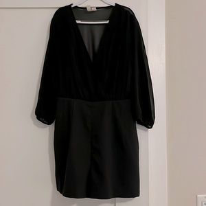 Black Romper, plunging V-neck chiffon bodice. Long tapered chiffon sleeves.